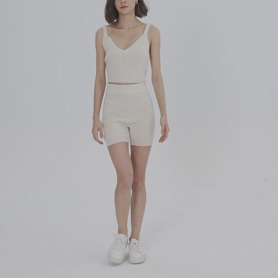 Model's wearing white Cashmere shorts and Cashmere tank top