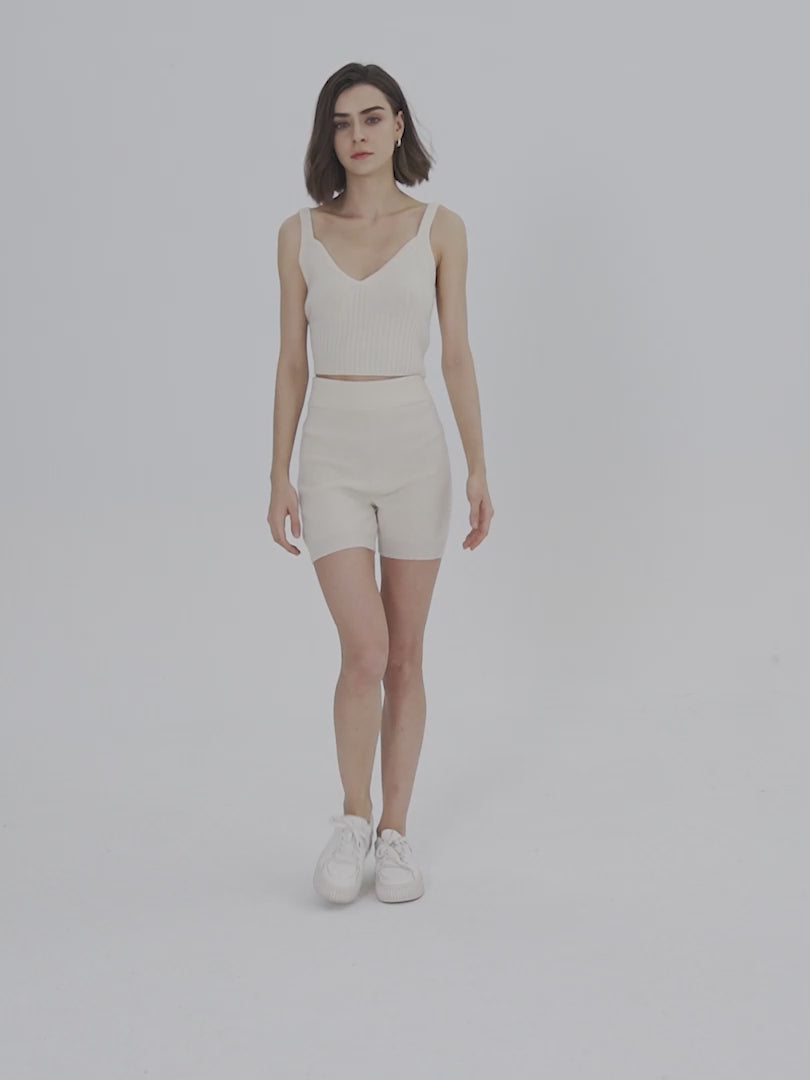 Model's wearing white Cashmere shorts and Cashmere tank top